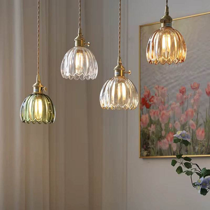 Antique-style amber glass pendant with ribbed texture emitting warm, cozy light