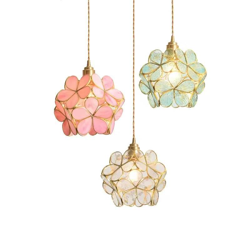 Floral glass pendant with petal-shaped colored glass in gold frame, available in pink, mint, and clear colors