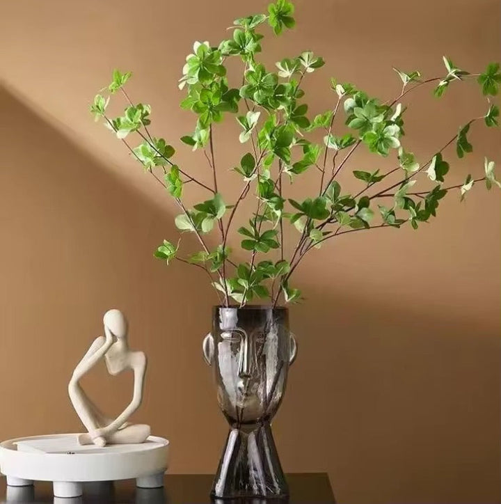 Faux Leaf Branches in Abstract Face Vase