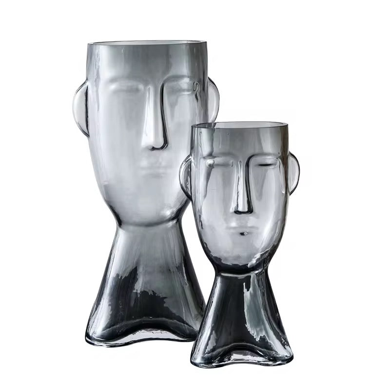 Faux Leaf Branches in Abstract Face Vase