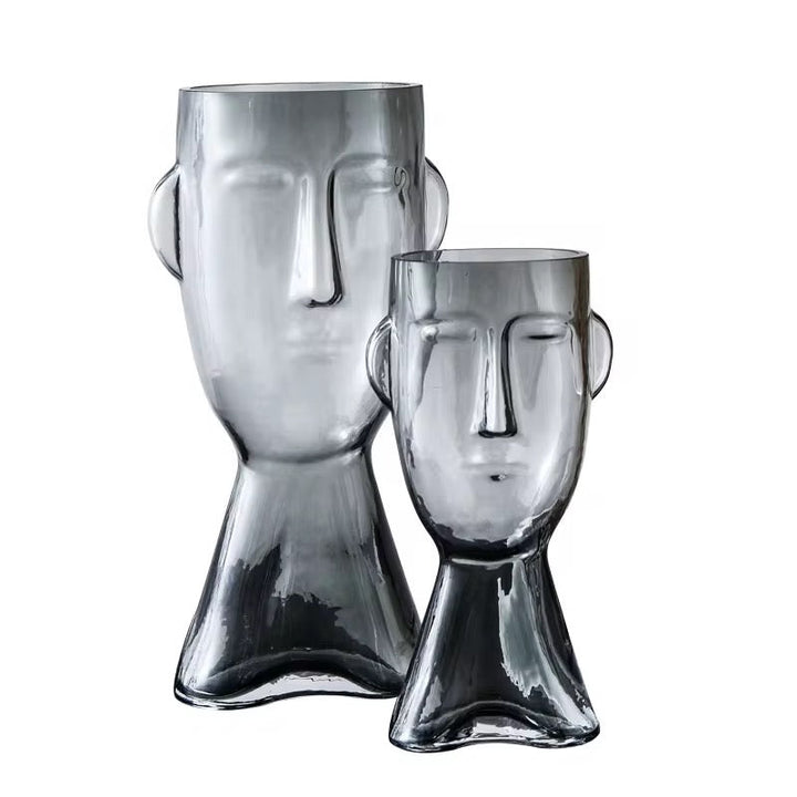 Faux Leaf Branches in Abstract Face Vase