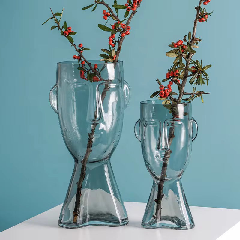 Faux Leaf Branches in Abstract Face Vase