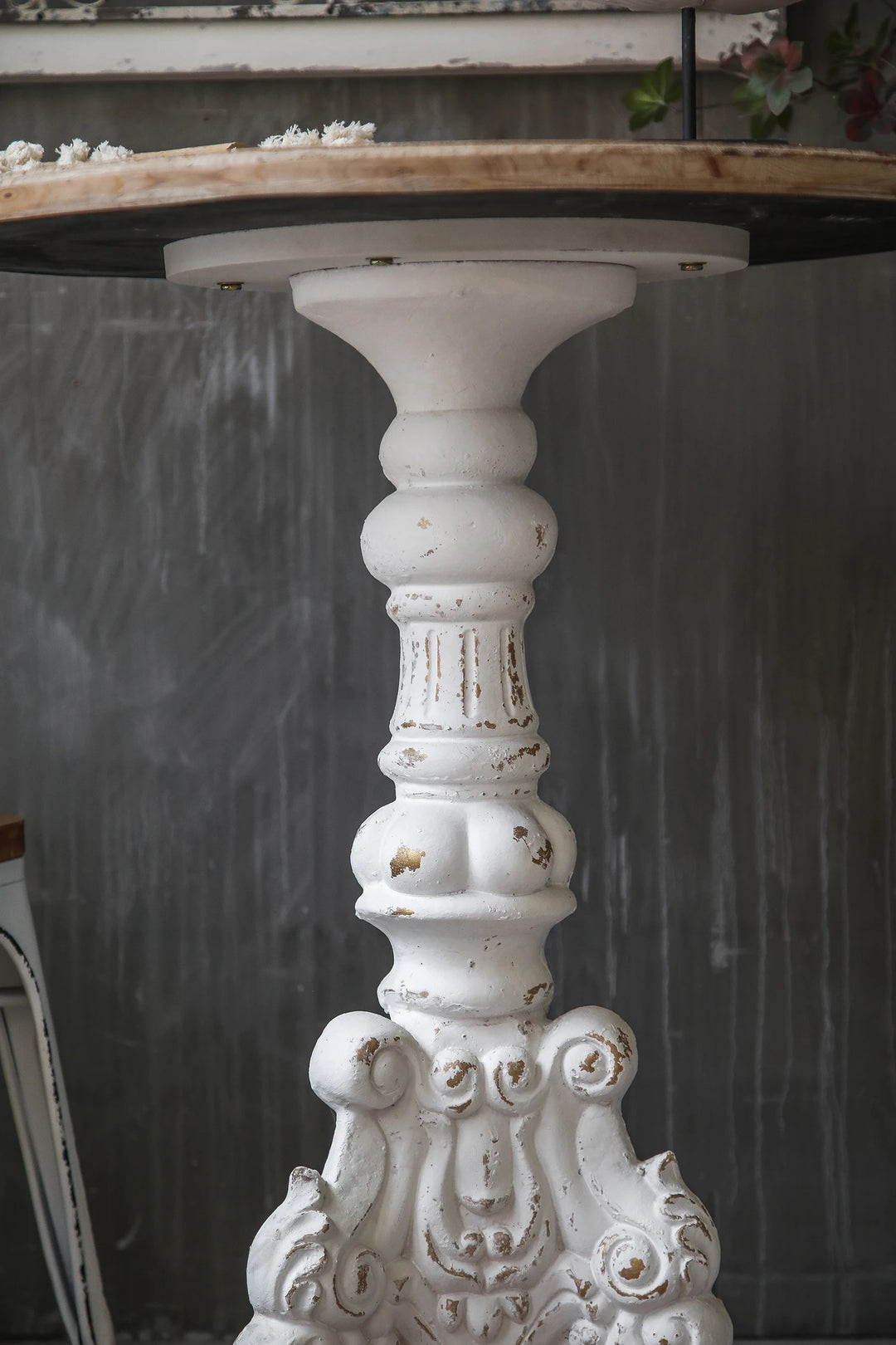 Vintage Rustic Round Accent Table with Ornate Carved Base