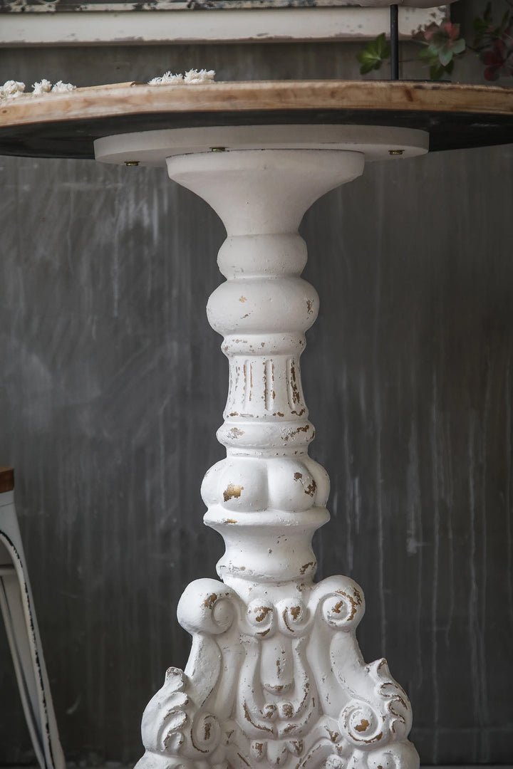 Vintage Rustic Round Accent Table with Ornate Carved Base