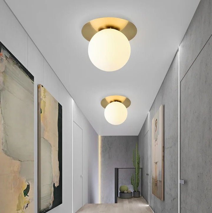 Modern Brass Ceiling Light with Frosted Glass Globe