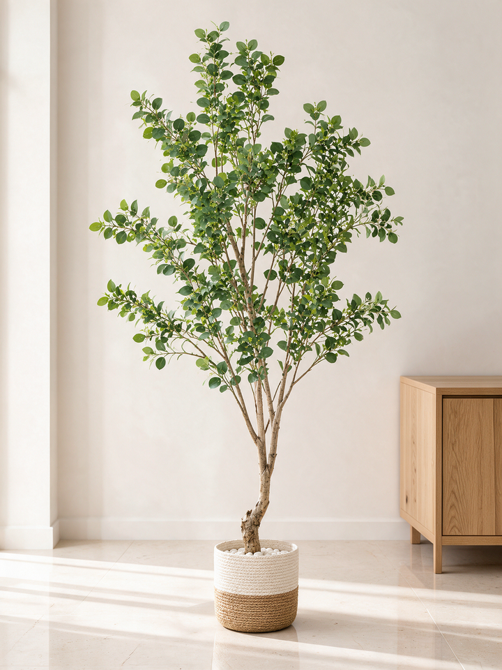 220 cm artificial green leaf tree in woven planter in minimalist entrance