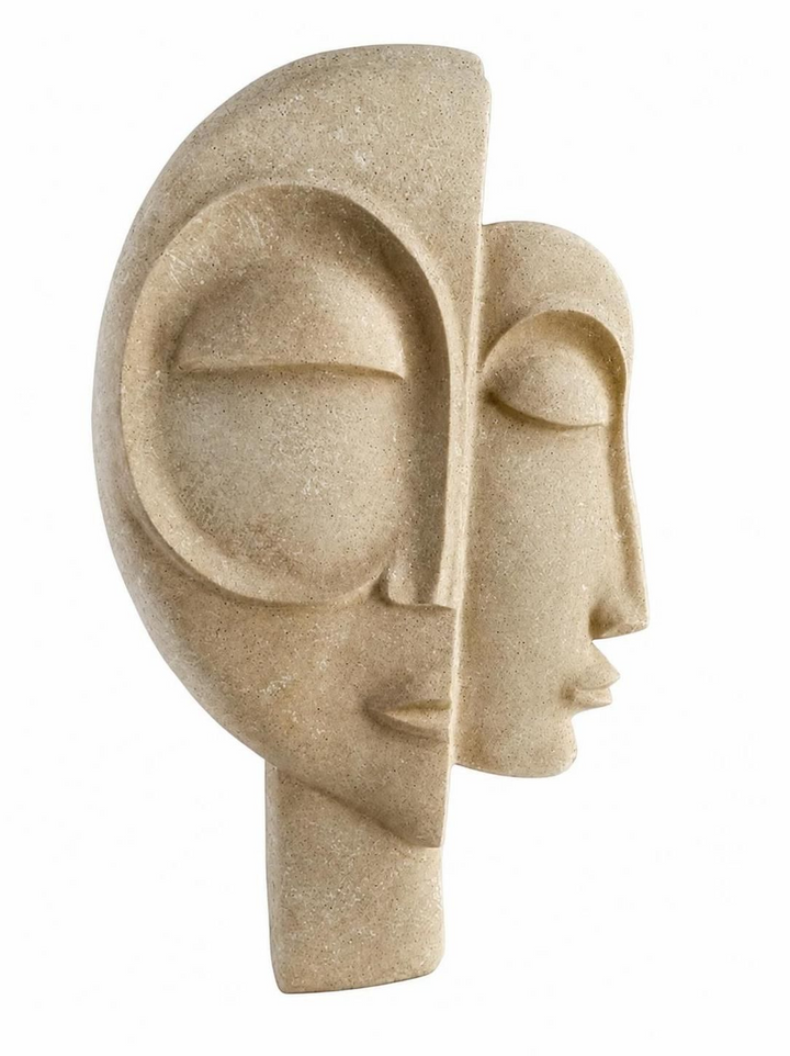 Sandy beige sculpture of two overlapping abstract faces