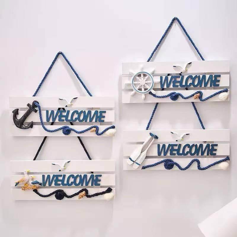Coastal Welcome Hanging Sign with nautical design for beach house entrance