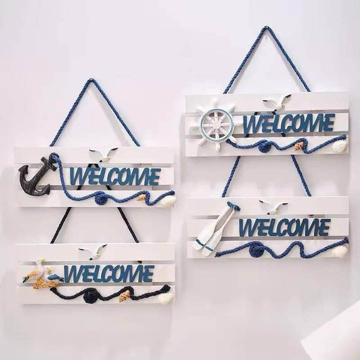 Coastal Welcome Hanging Sign with nautical design for beach house entrance