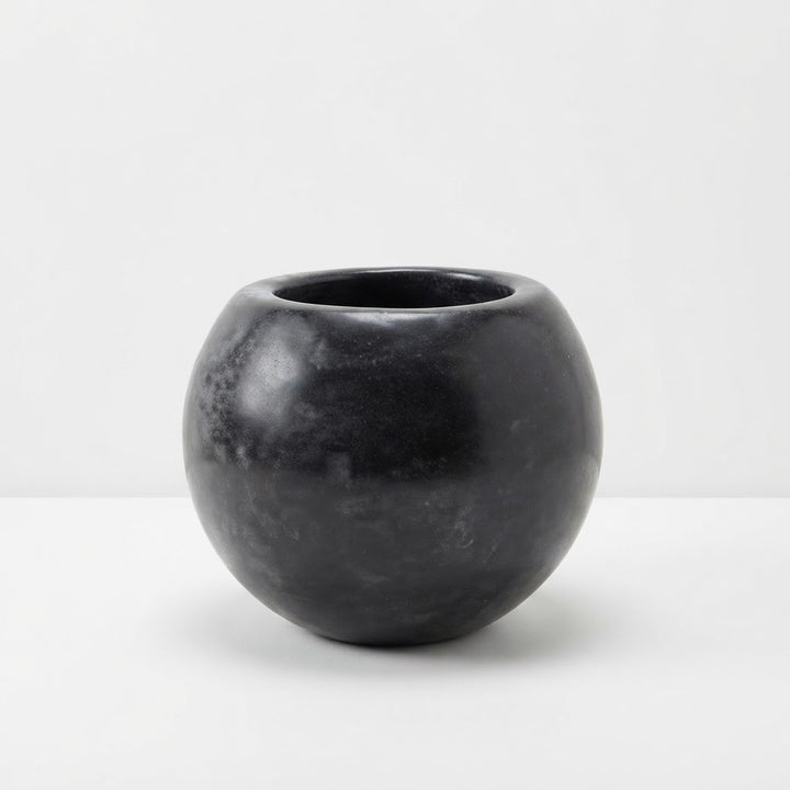 Glossy black round fiberglass planter with a wide circular opening on a plain white studio background.