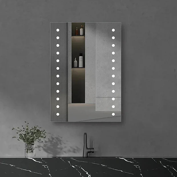 Rectangular Hollywood-style LED mirror with bulb border mounted on dark wall