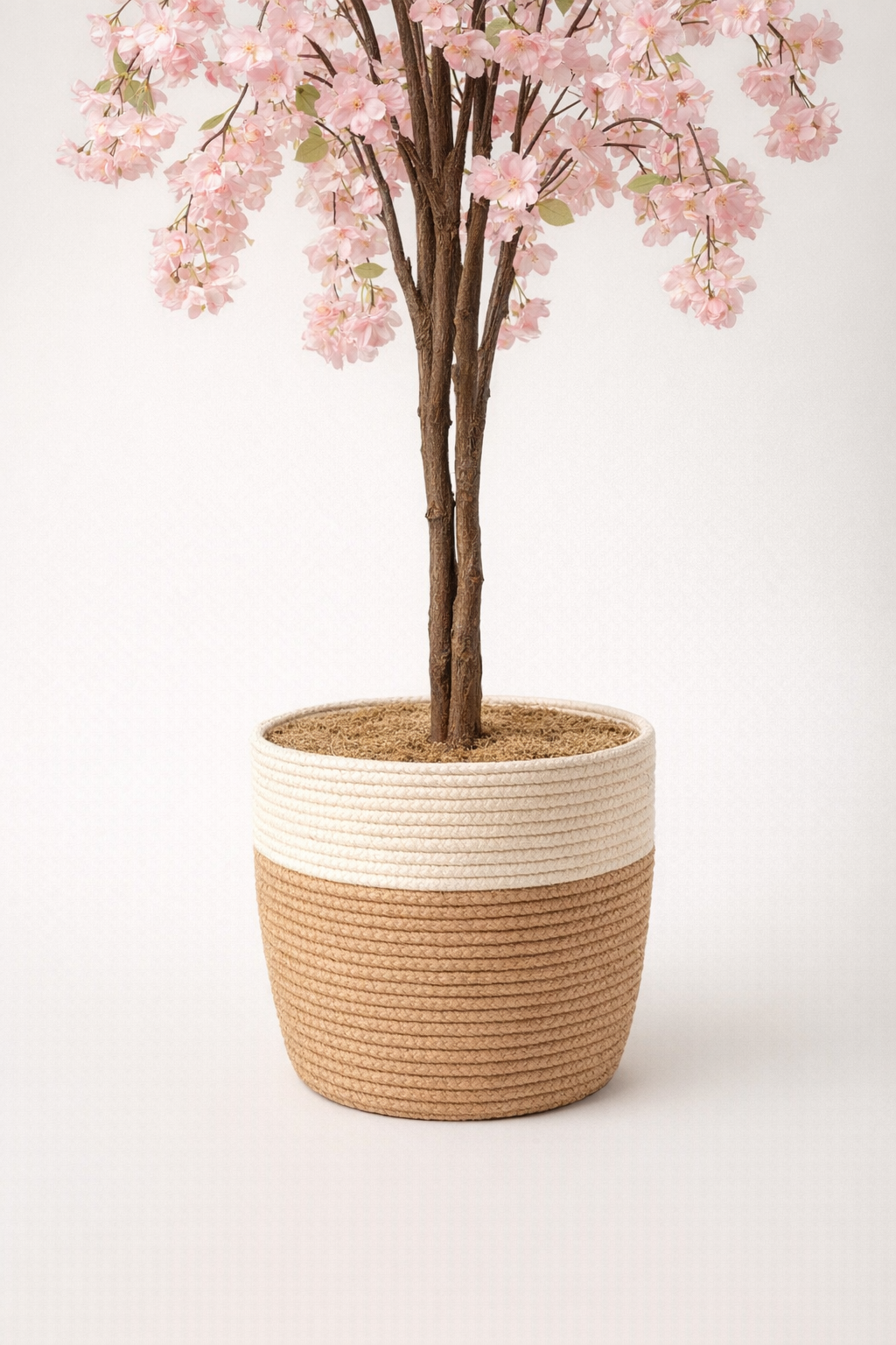 Artificial Pink Cherry Blossom Tree in Woven Pot – 155 cm — trunk and original planter close-up