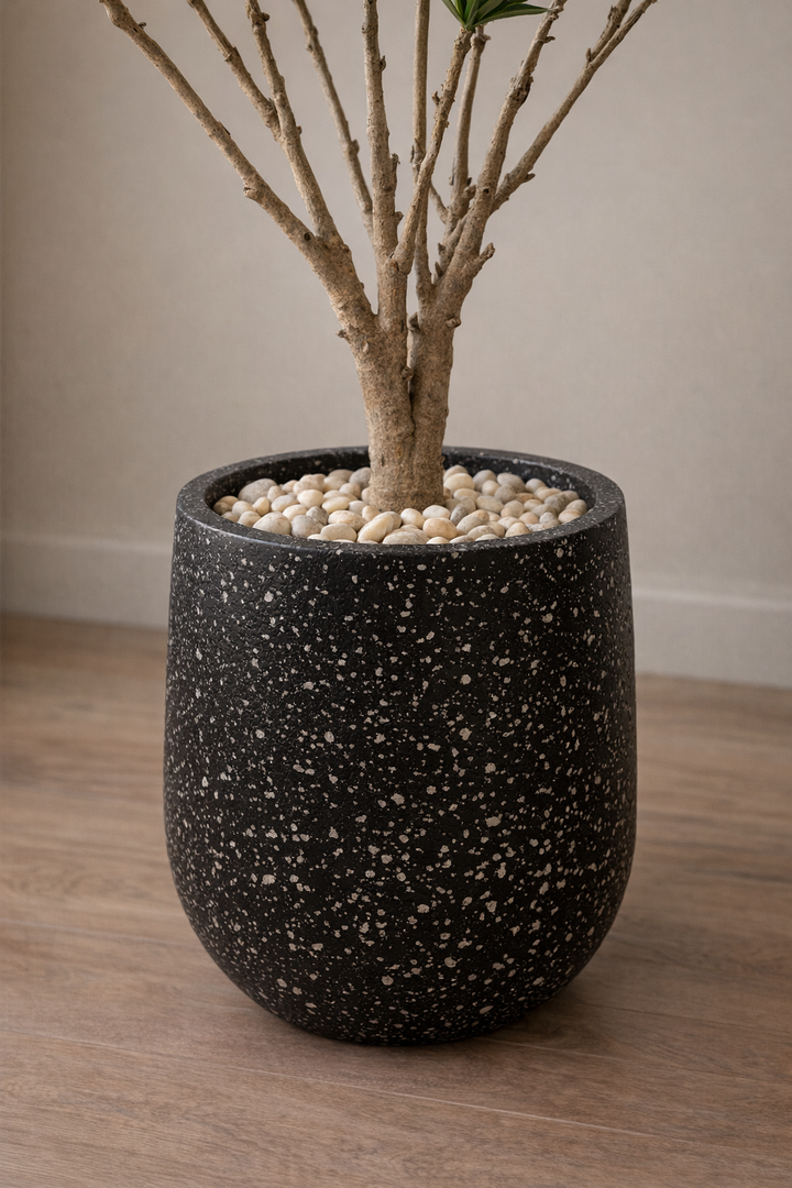 Artificial Green Foliage Tree in Black Fiberglass Pot – 180 cm — trunk and original planter close-up