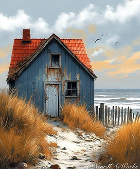 Coastal cottage canvas wall art with blue cottage, golden dune grass, and sea background