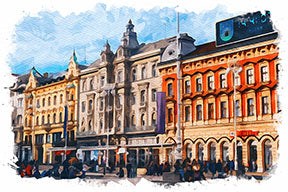 Wadi Home European cityscape watercolor wall art with detailed architecture and vibrant colors, displayed above a sofa.