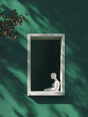 Wadi Home minimalist wall art featuring a white figure in a window frame against a deep green background with dramatic shadows.
