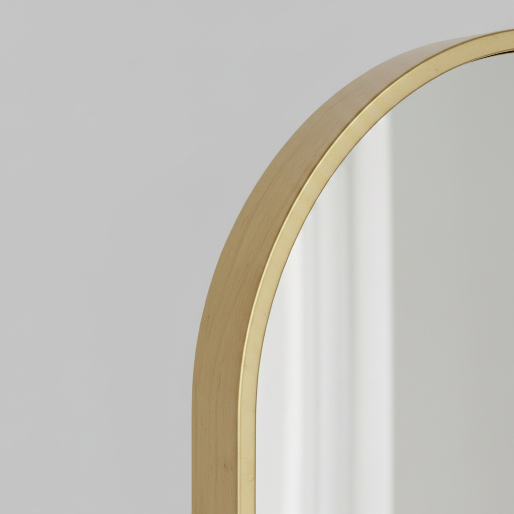 Close-up macro of gold wooden frame corner showing wood grain and finish quality