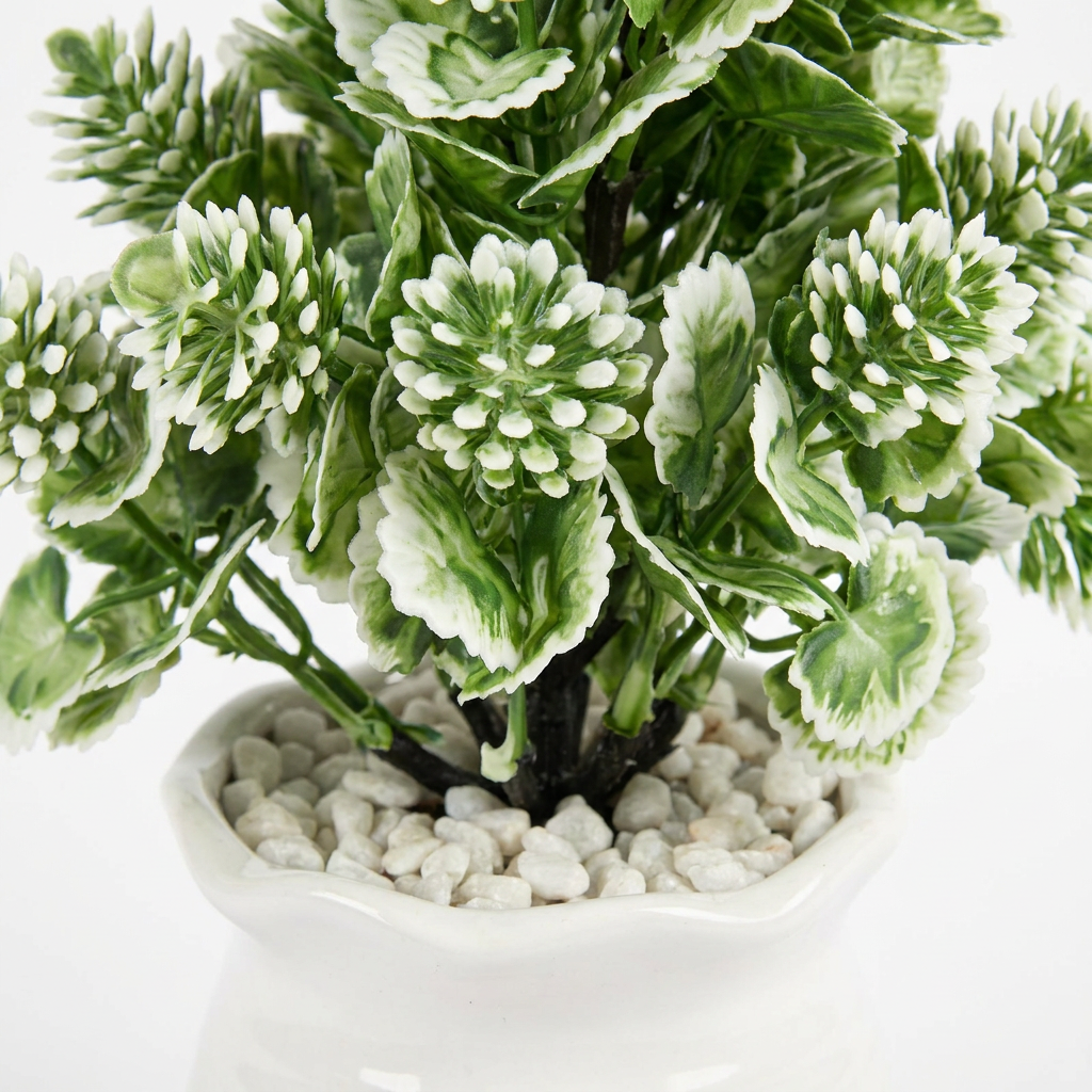 Close-up macro shot of artificial plant leaves on white background