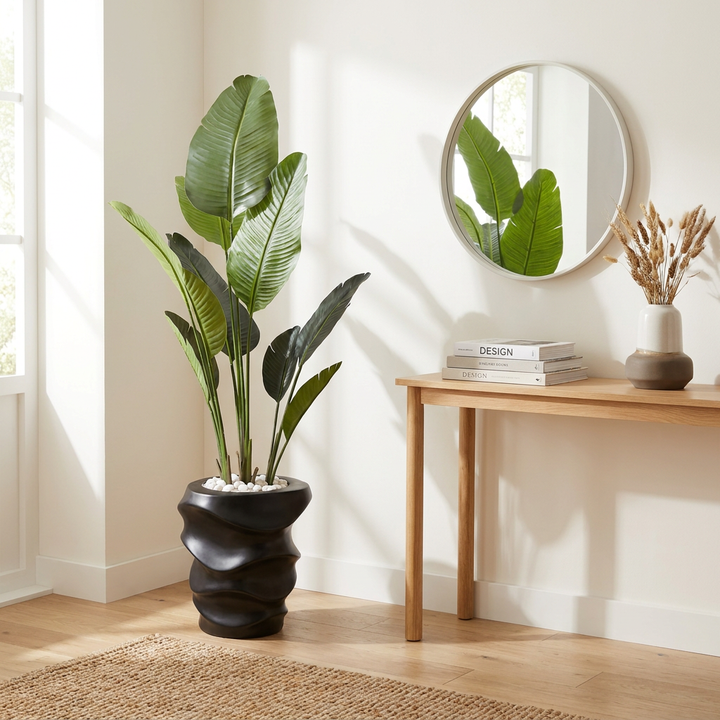 Artificial indoor plant styled in a bright home entryway or office
