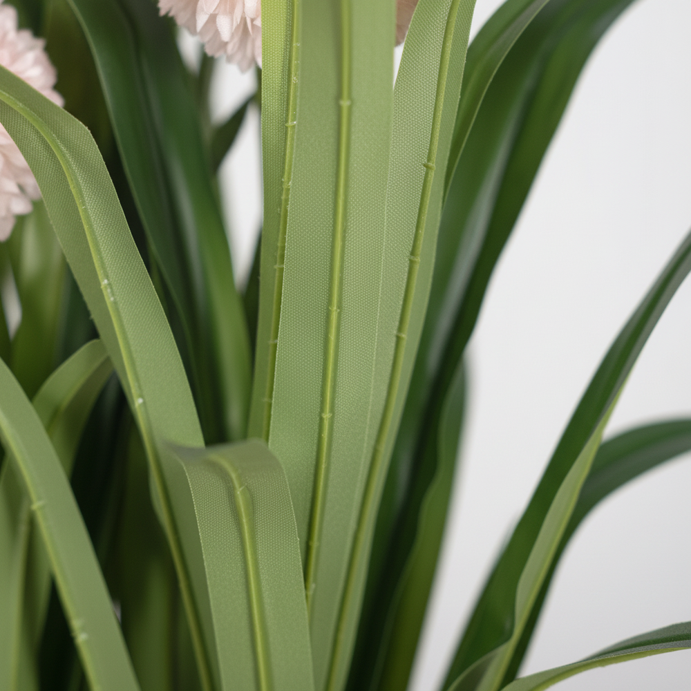 Close-up of artificial baby's breath delicate white flowers on white studio background