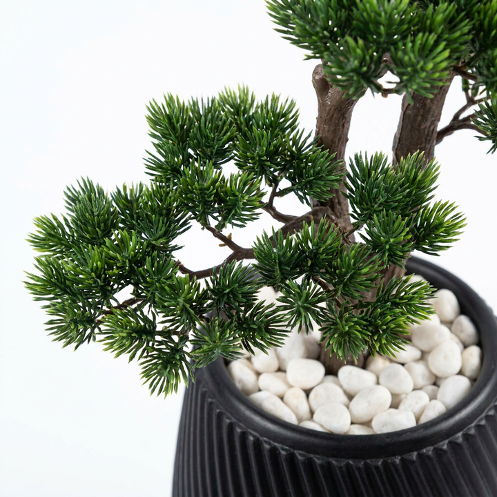 Close-up detail of artificial plant leaves on white background