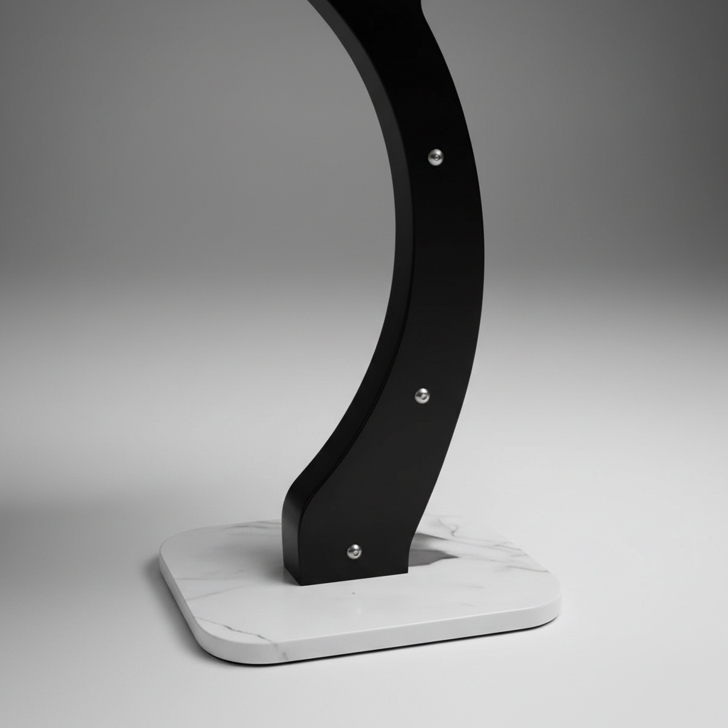 Close-up macro detail of black curved leg with precision professional lighting