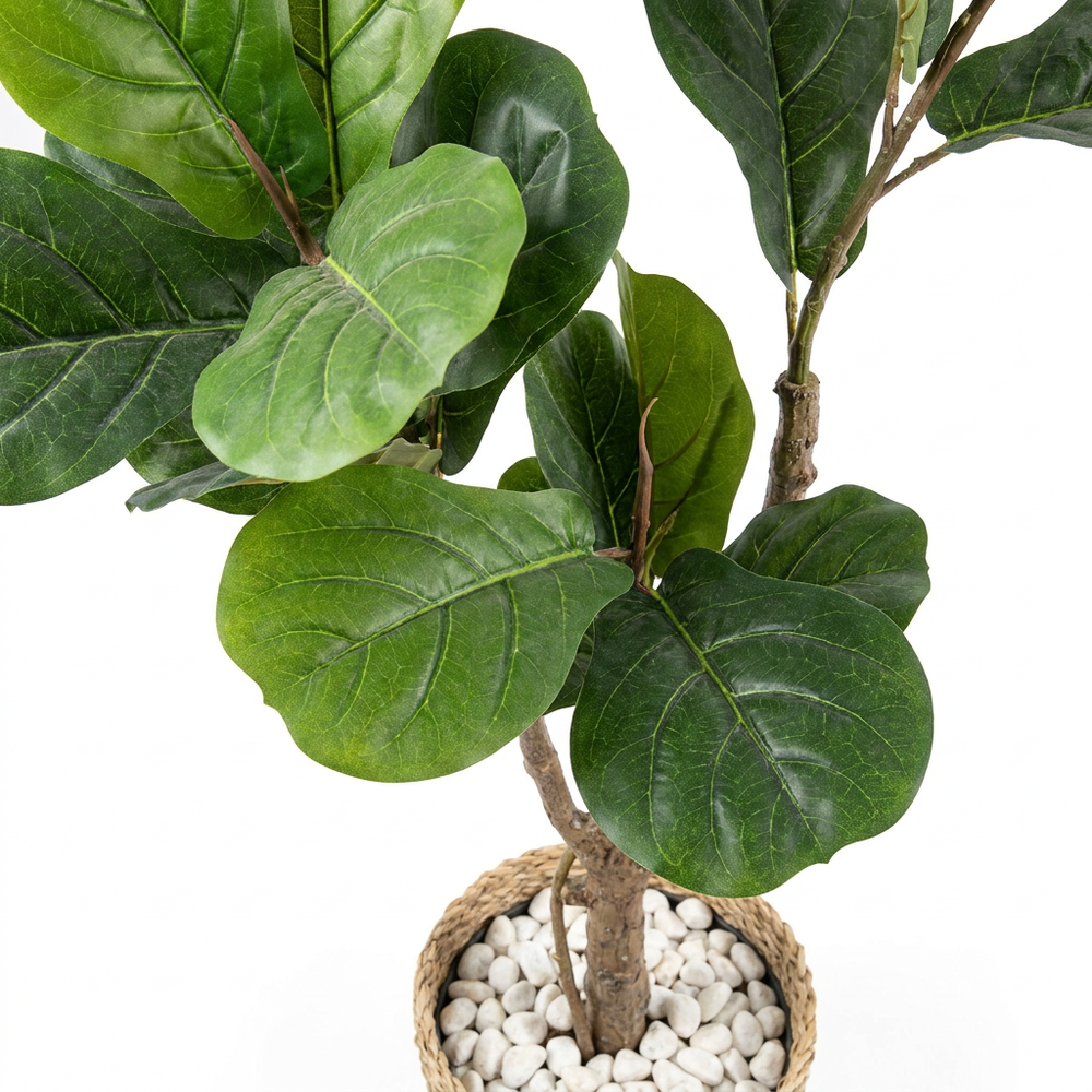 Close-up macro shot of artificial plant leaves with white pebbles