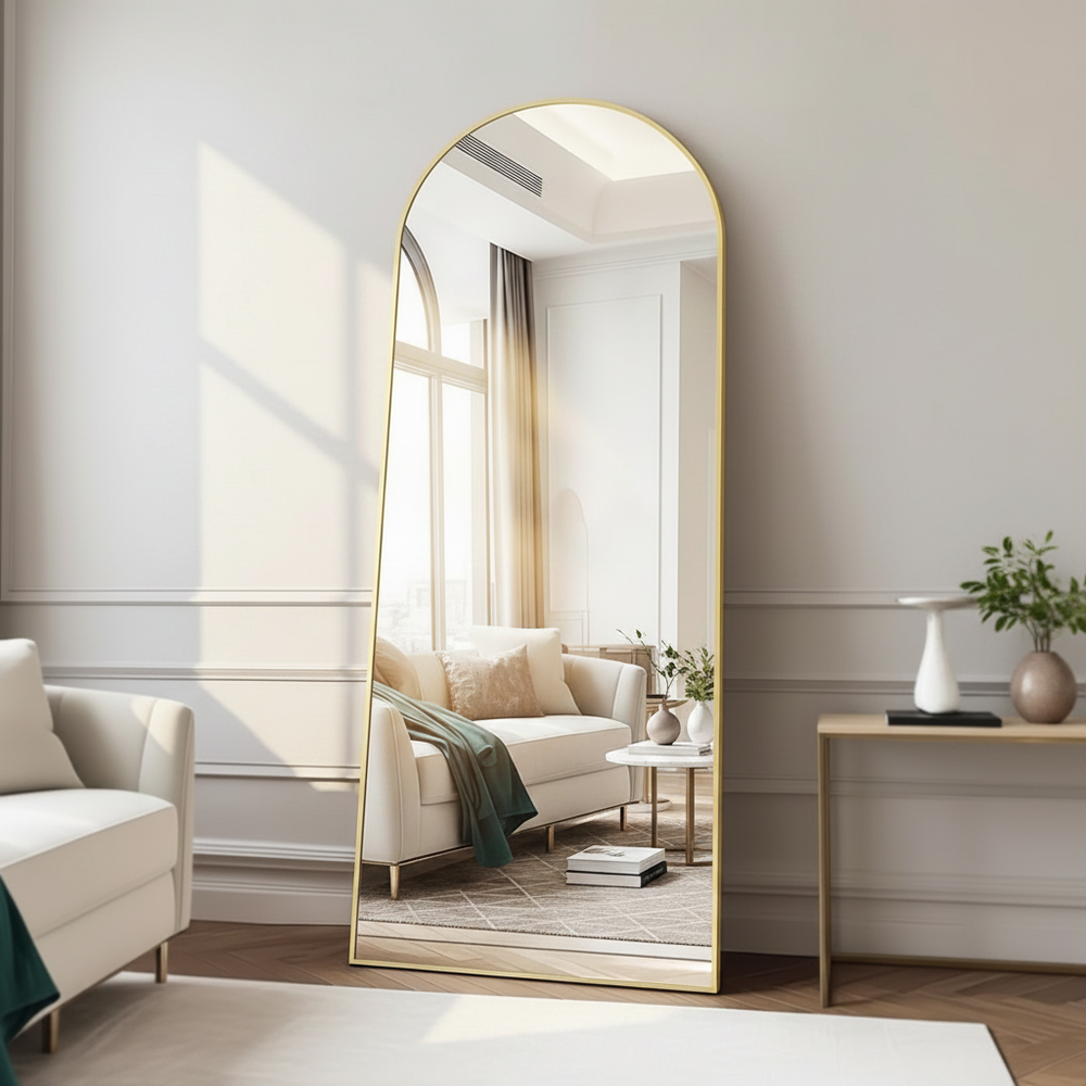 Decorative mirror with gold wooden frame leaning in modern living room