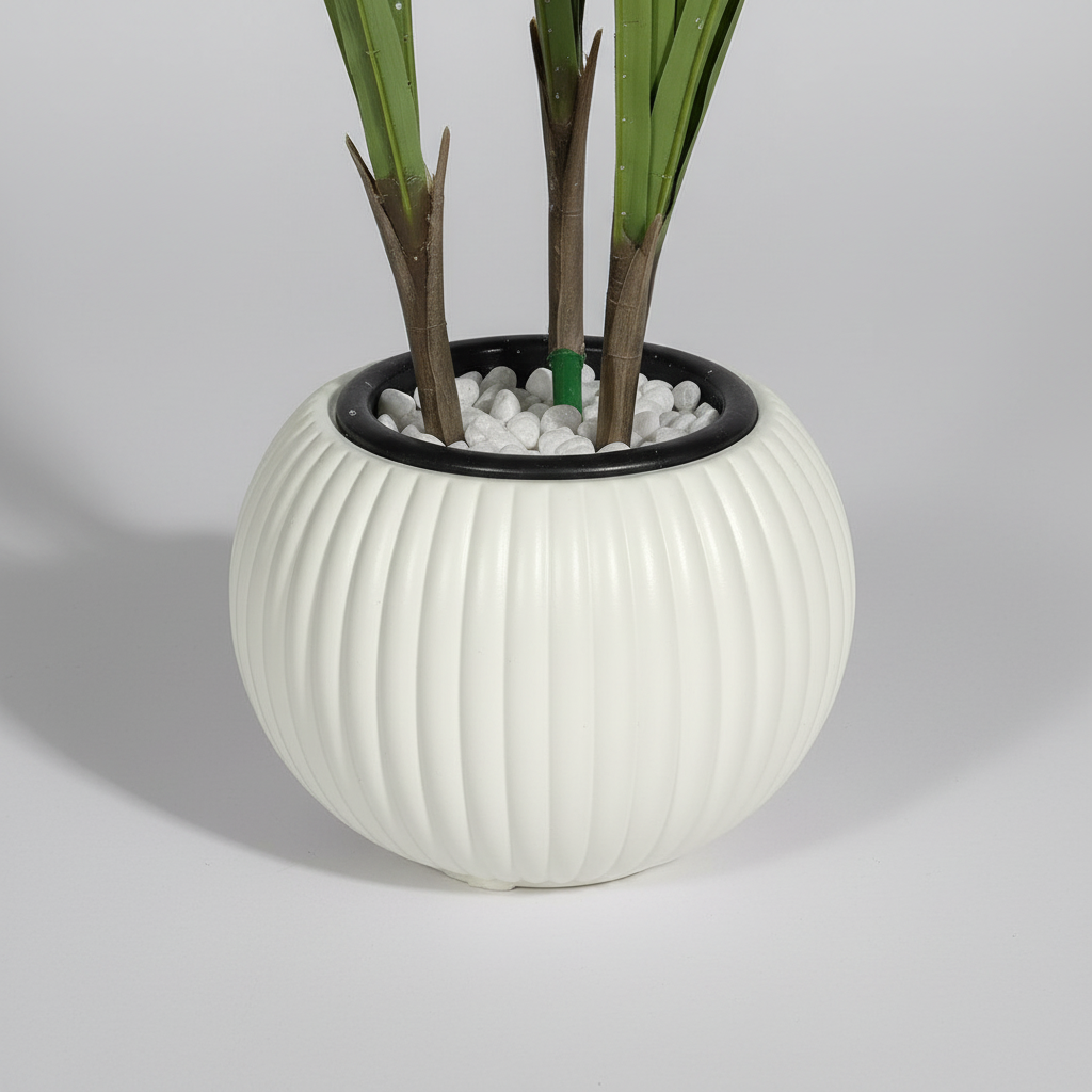 Close-up macro of artificial monstera white pot on light gray studio background