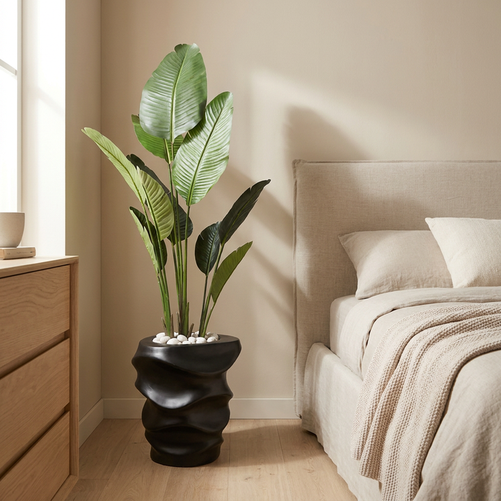 Artificial indoor plant in a minimalist bedroom corner