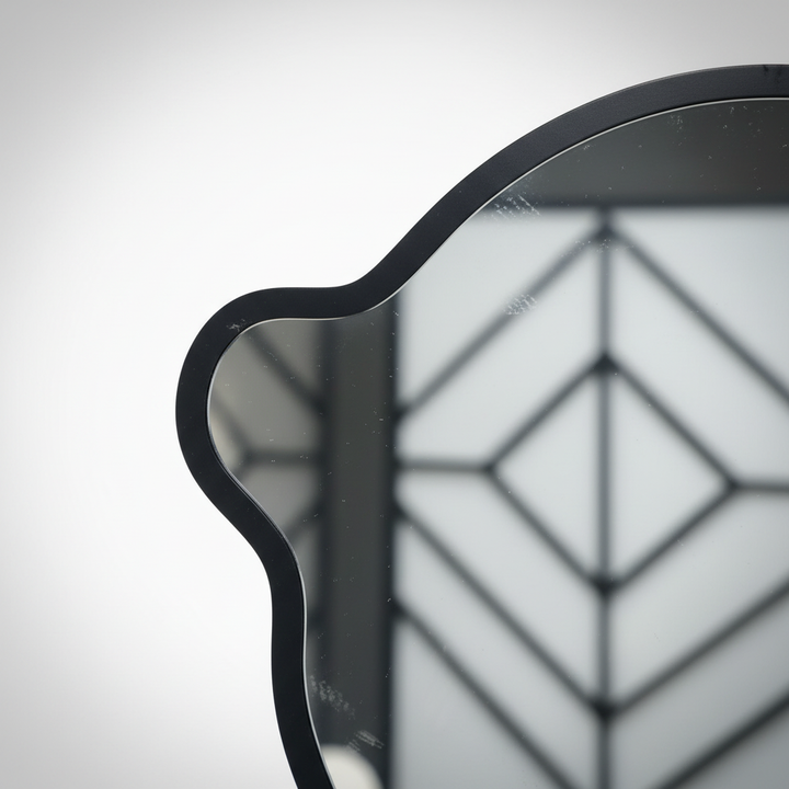 Close-up of bear mirror frame and geometric design detail