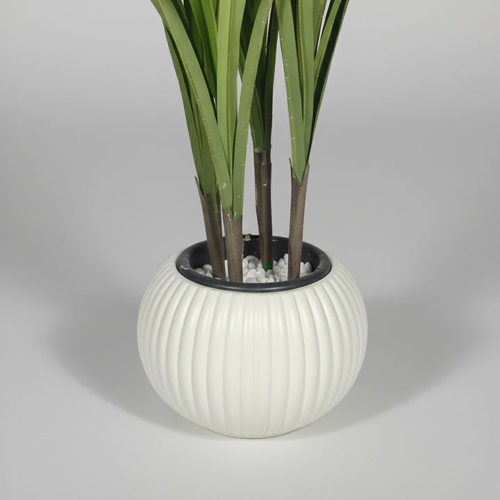 Close-up macro of artificial bamboo white pot on light gray studio background