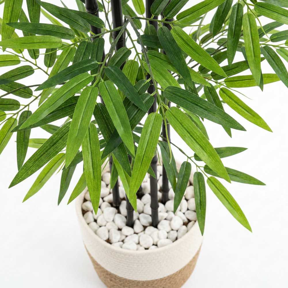 Close-up macro shot of artificial plant leaves on white background