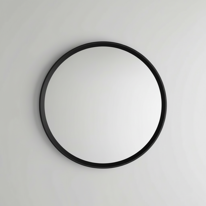 Black wood-framed wall mirror studio shot on white background