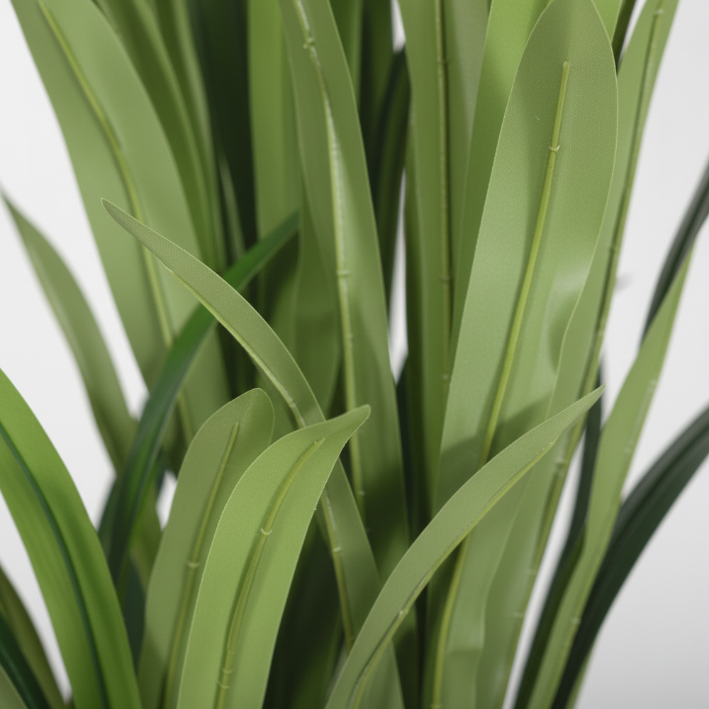 Close-up of artificial bamboo sparse foliage on white studio background