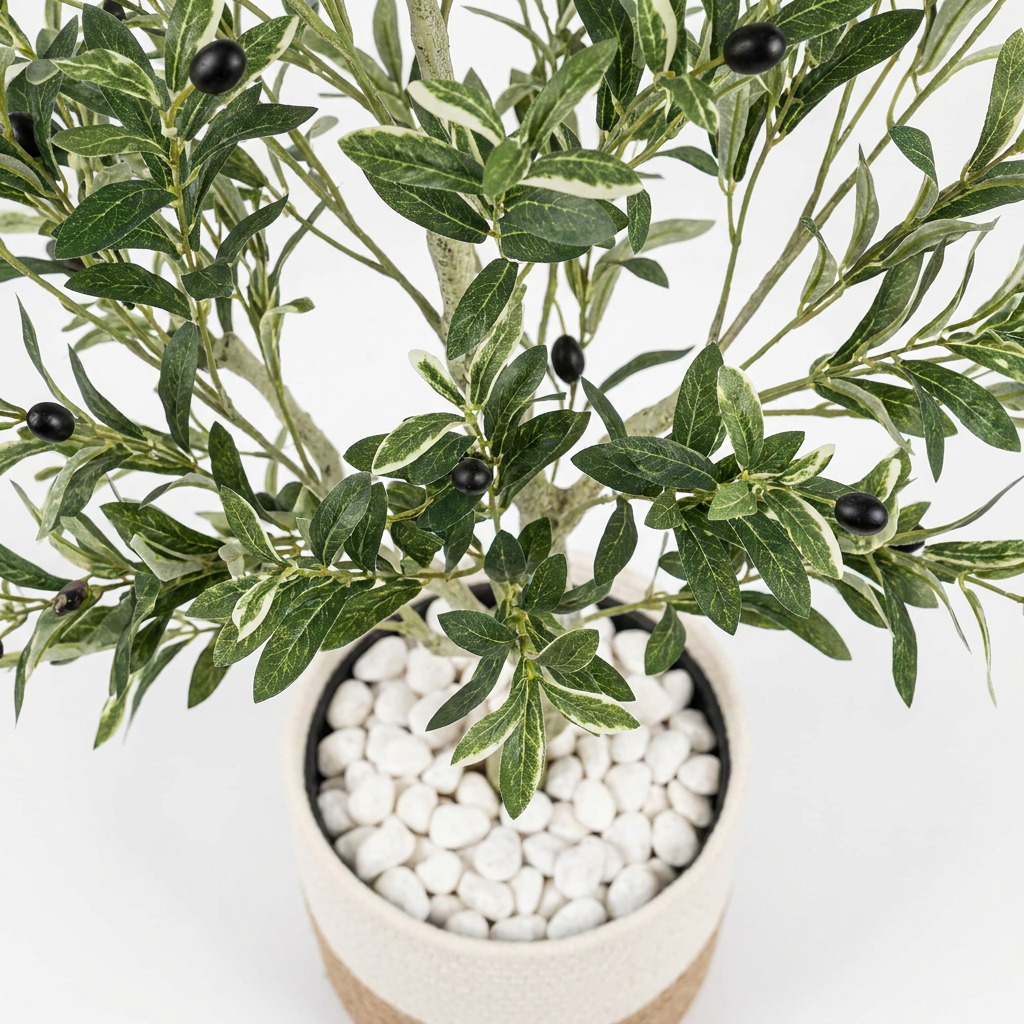 Close-up macro shot of artificial plant leaves on white background