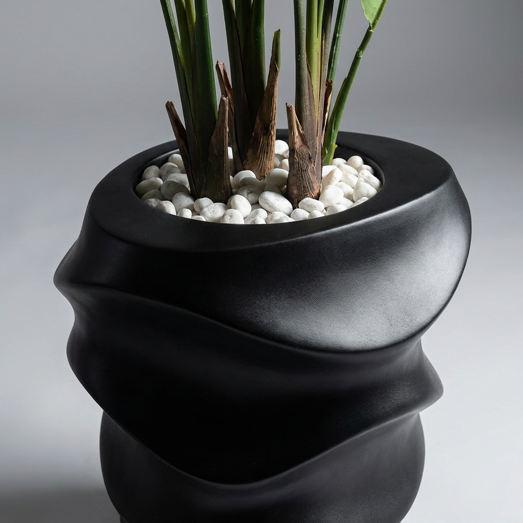 Close-up of pot and trunk base with white pebbles on gray background