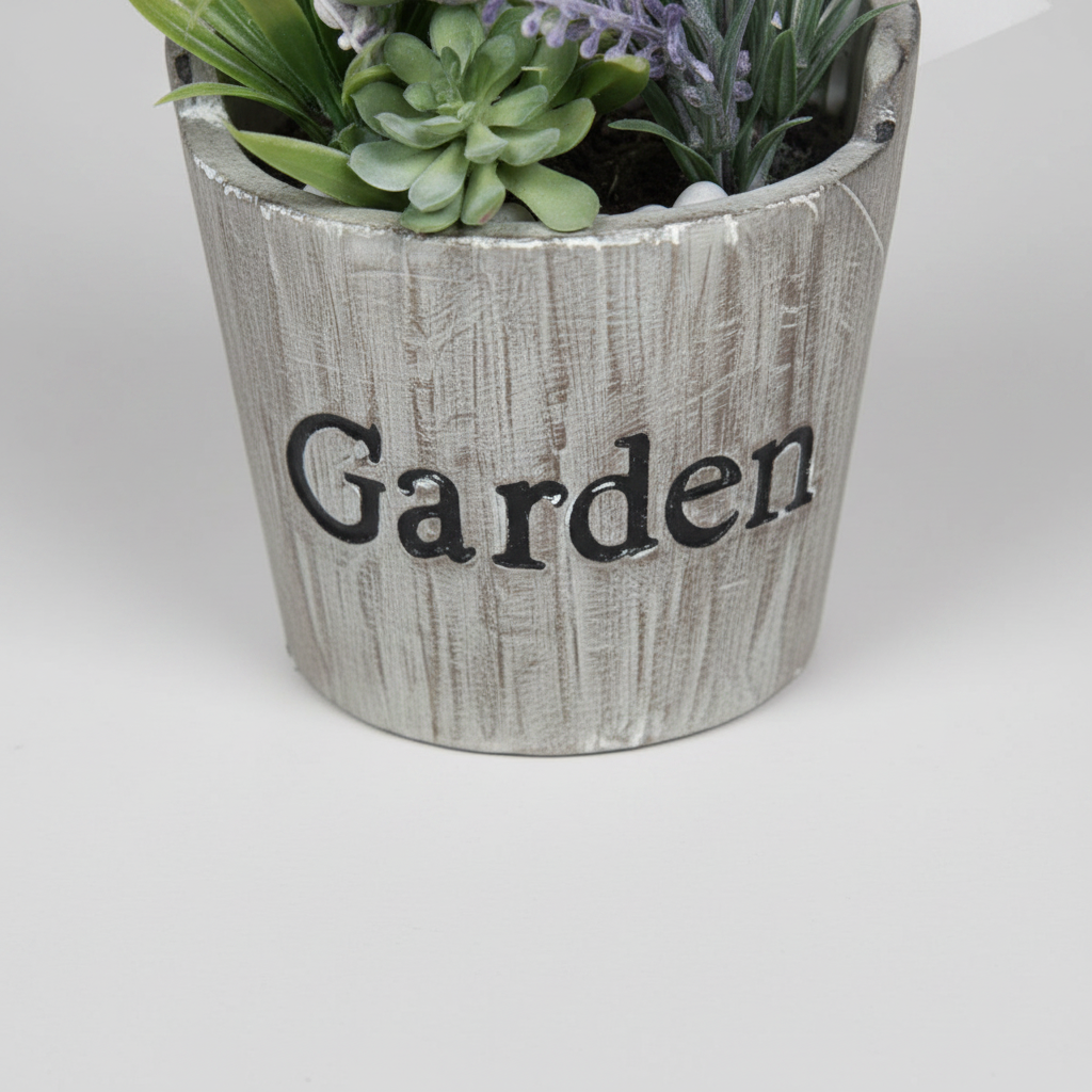 Close-up macro of artificial moss ball terracotta pot on light gray studio background