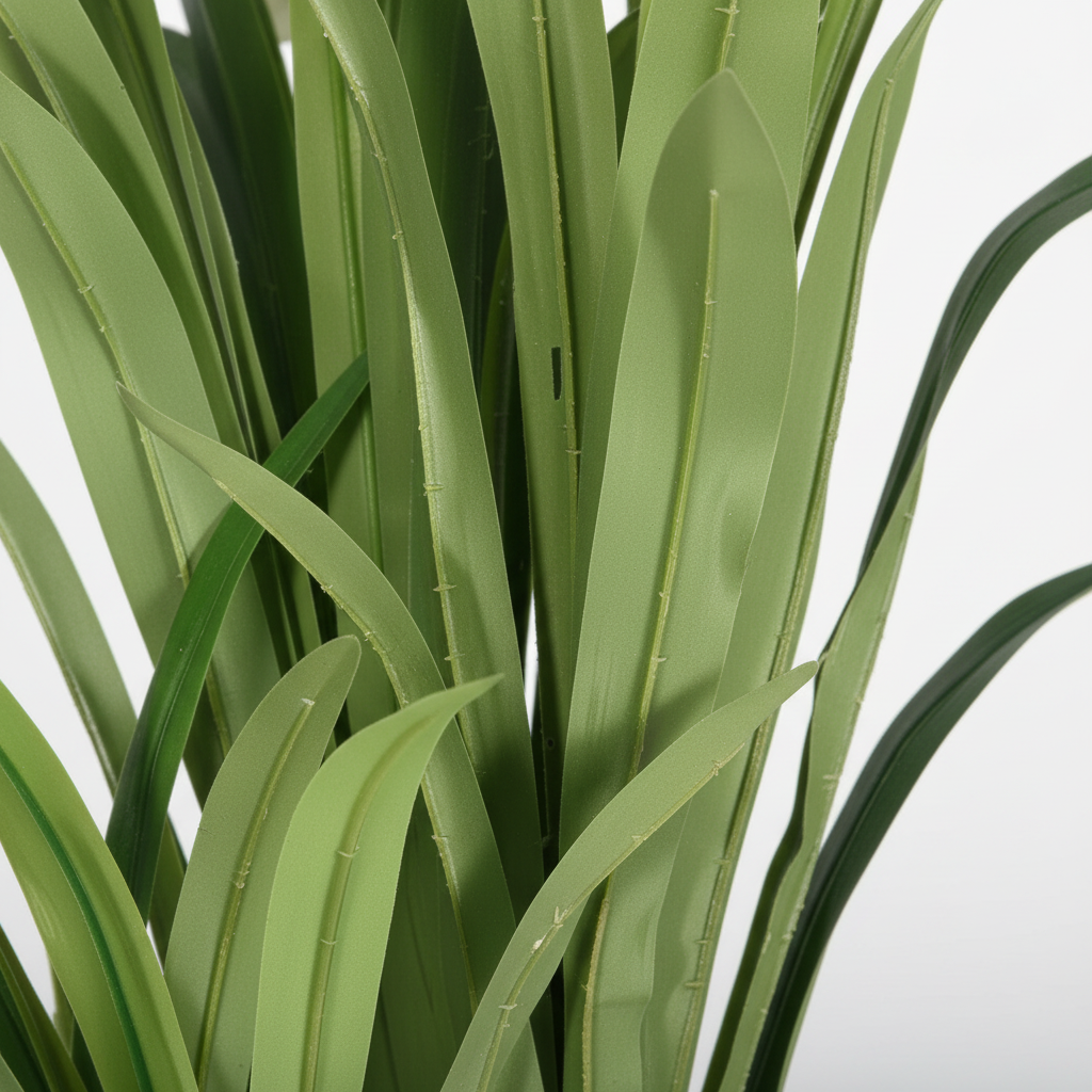 Close-up of artificial pothos heart-shaped leaves on white studio background