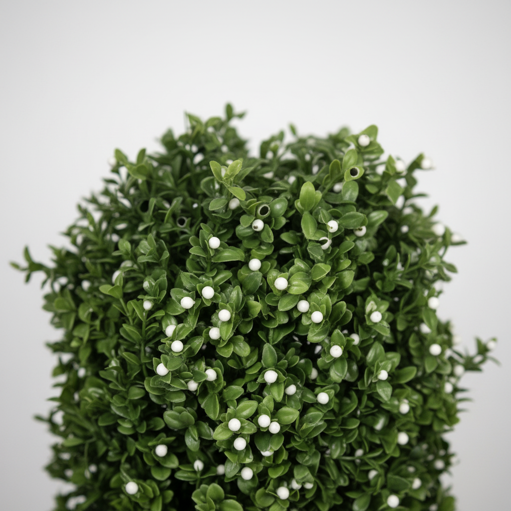 Close-up of artificial succulent rosette leaves on white studio background