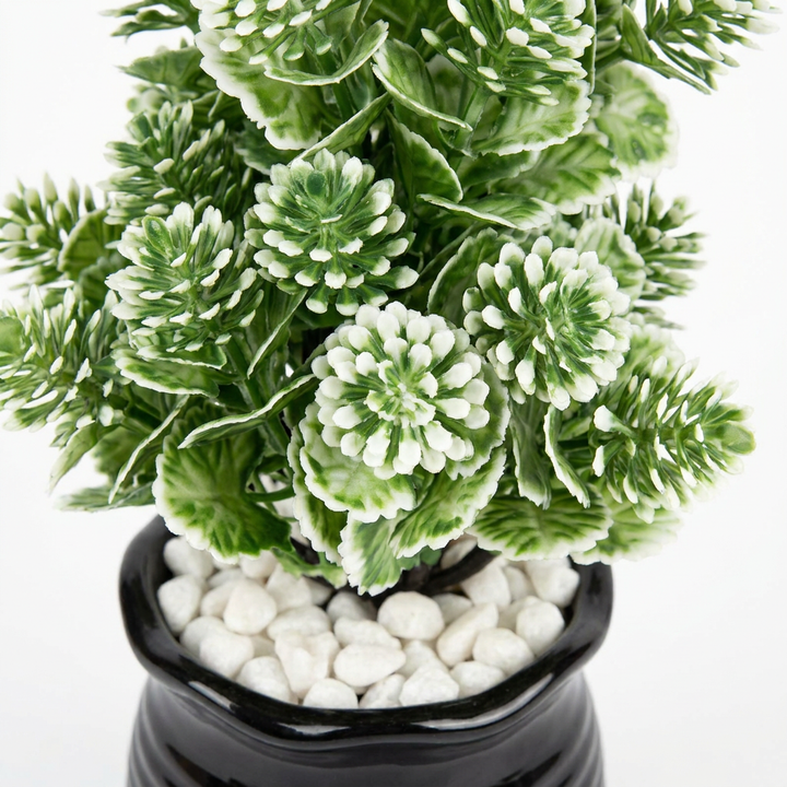 Close-up macro shot of artificial plant leaves on white background
