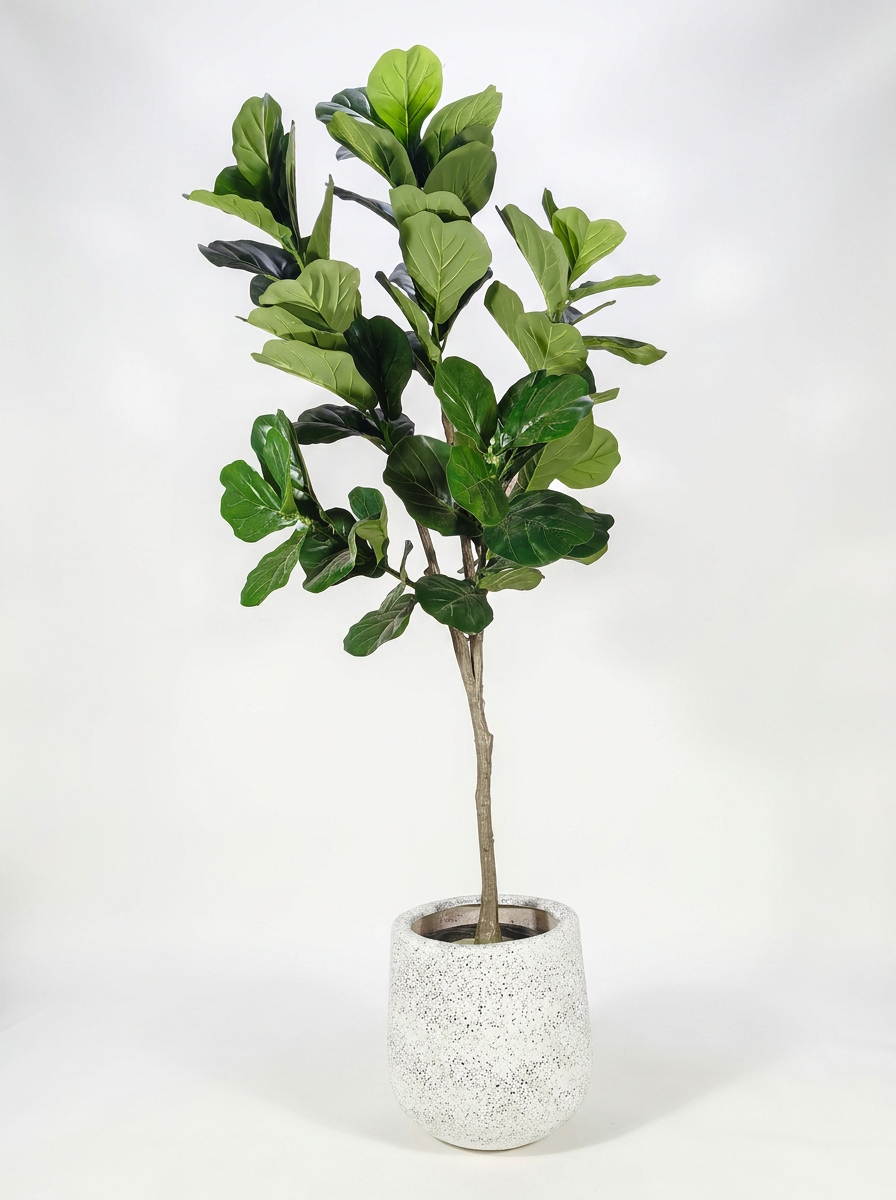 Artificial plant with pot on white studio background