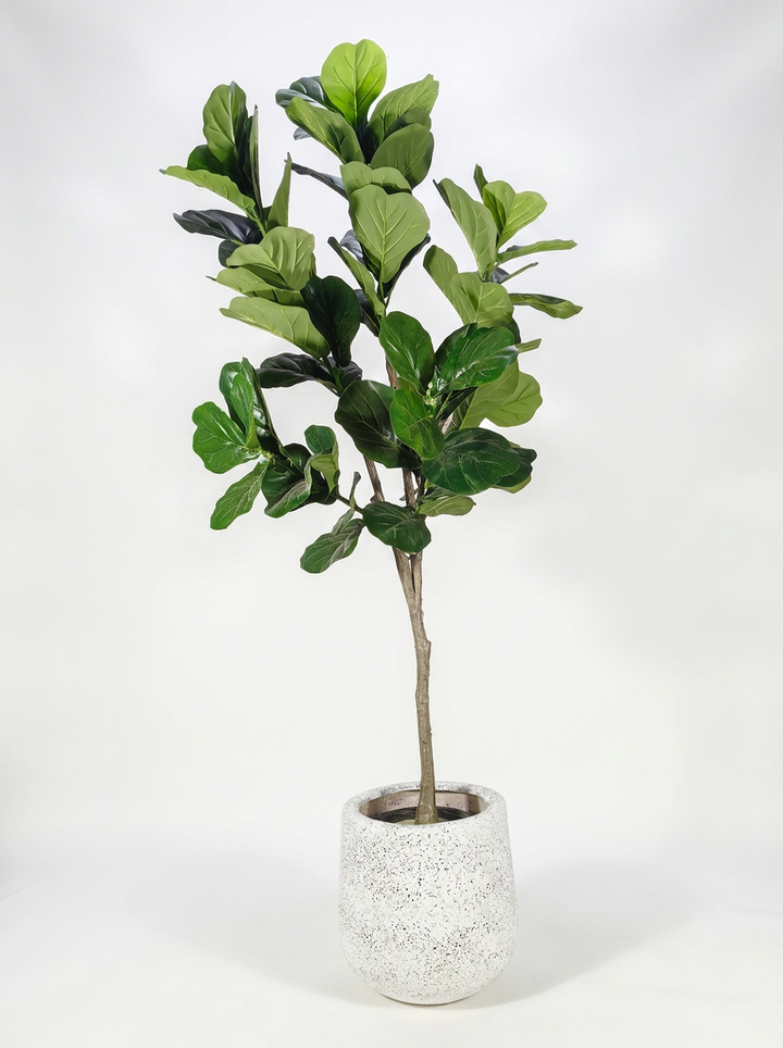 Artificial plant with pot on white studio background