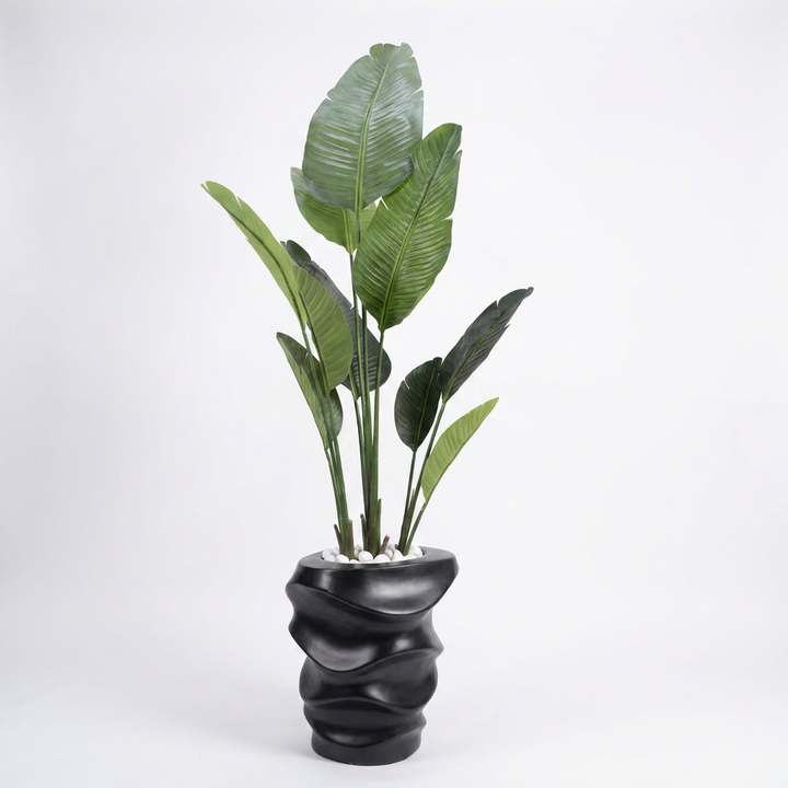 Artificial indoor plant on clean white studio background