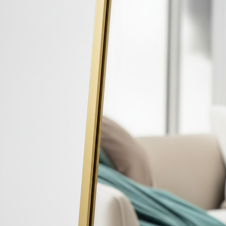 Close-up of gold wooden frame detail showing grain and craftsmanship