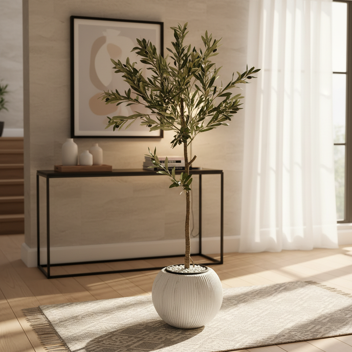 Artificial ficus tree in stylish modern entryway with console table