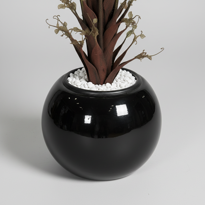 Close-up macro of artificial snake plant gray pot on light gray studio background