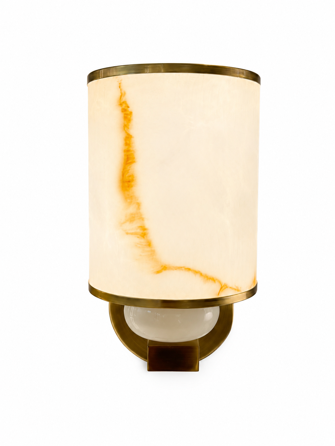 Luxury alabaster cylinder wall sconce with antique brass frame emitting warm ambient light for modern luxury interiors.