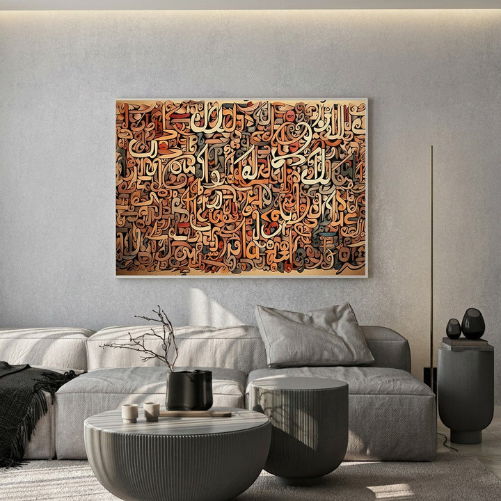 Wadi Home abstract Arabic calligraphy canvas art in brown and terracotta tones hanging above a modern grey sofa.