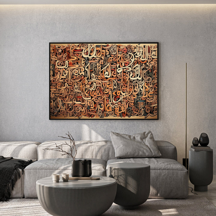 Wadi Home abstract Arabic calligraphy canvas art in brown and terracotta tones hanging above a modern grey sofa.